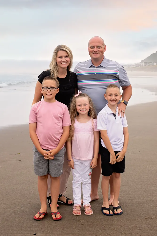 Dr. Jeremy Walker – Kuna Idaho family dentist and founder of Deluxe Dental – with his wife Kimberly and their children McKay, Cade, and Kaleah at the beach